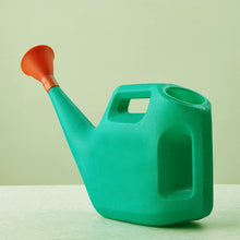 Plastic watering can with a sprayer, ideal for indoor and outdoor gardening