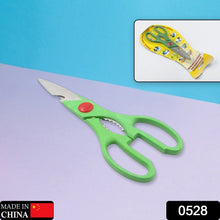 Close-up of kitchen scissors with sharp blades and bottle opener feature.