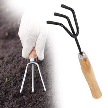 Set of gardening tools including shovel, rake, and trowel.